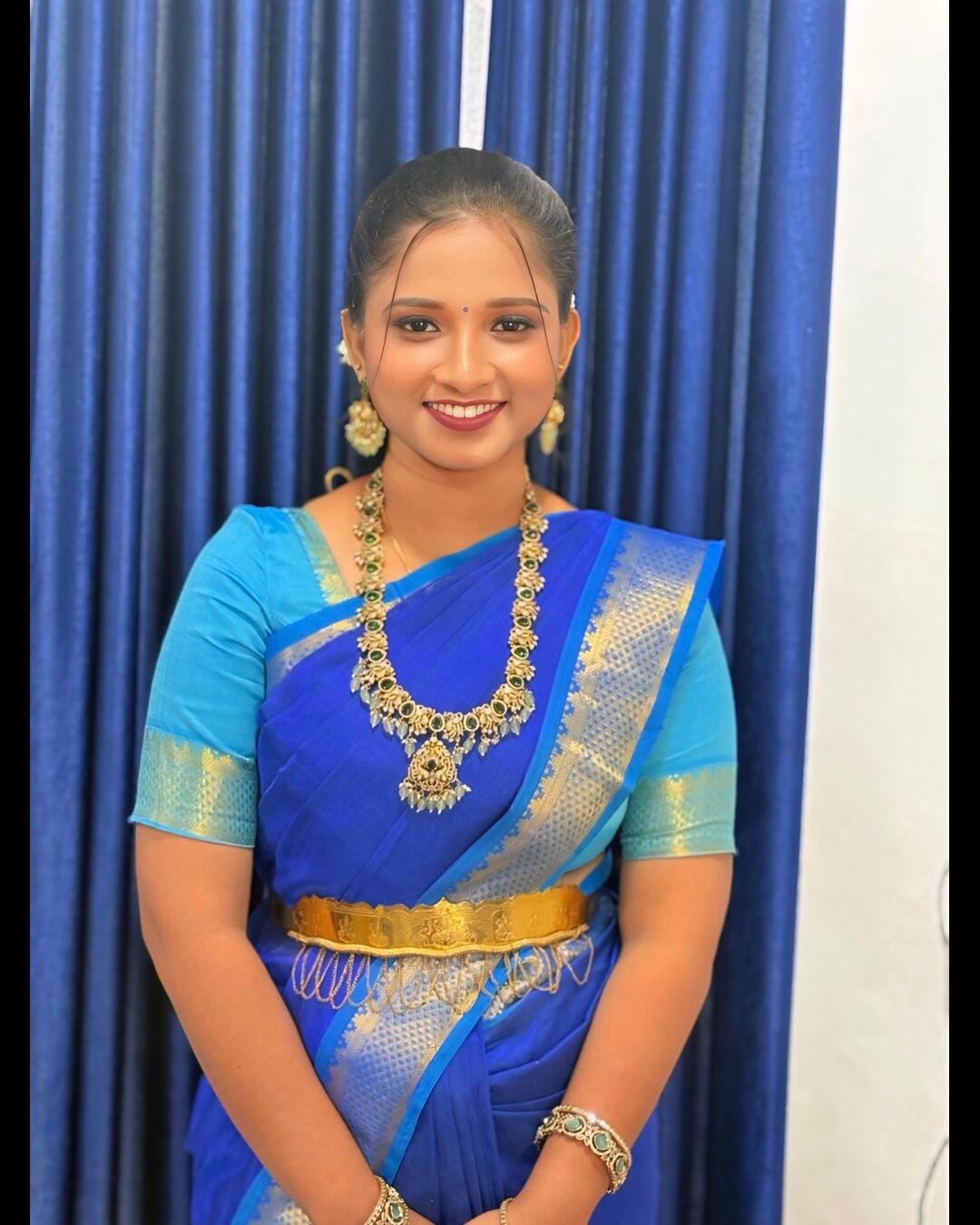 Traditional bridal makeup look in blue saree at Chennai salon